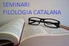 Imatge d'un llibre obert amb unes ulleres de vista damunt